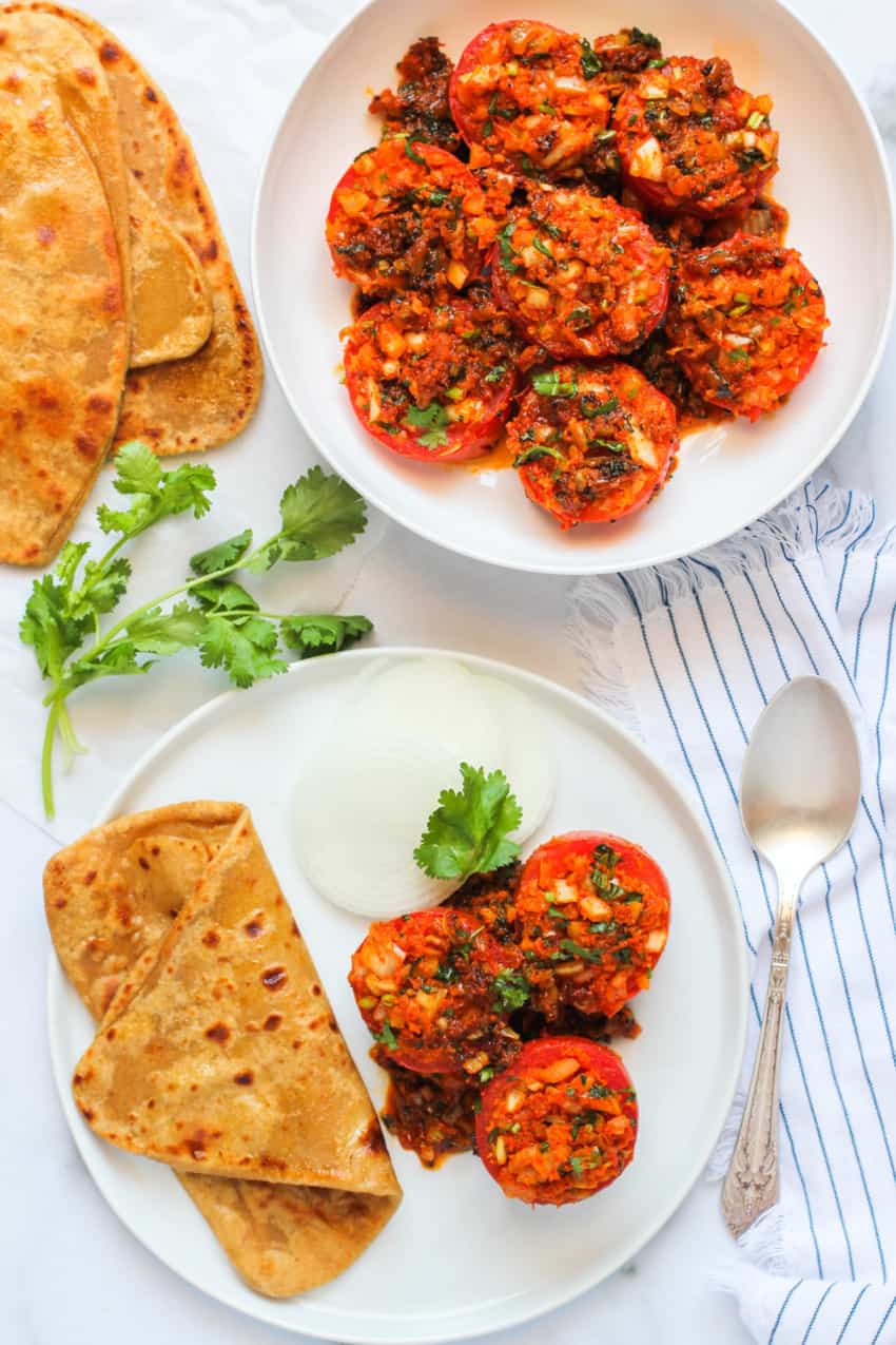stuffed tomatoes served with parathas 