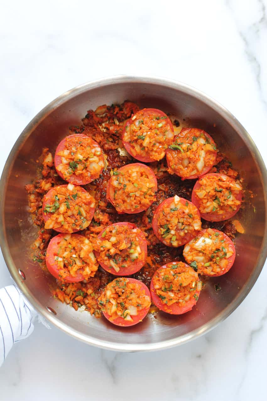 cooked tomatoes in a frying pan