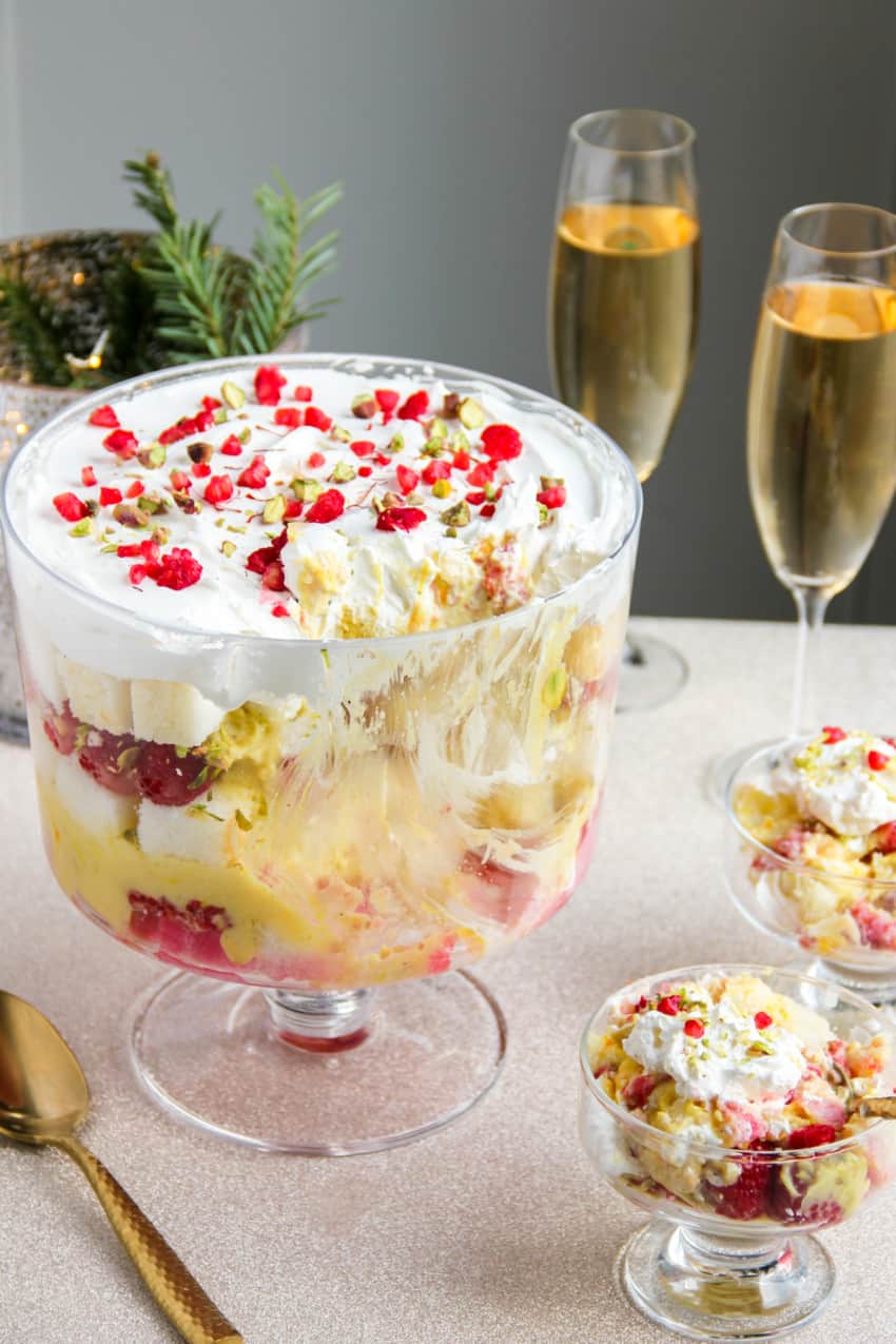 Raspberry trifle in a trifle bowl and serving bowls