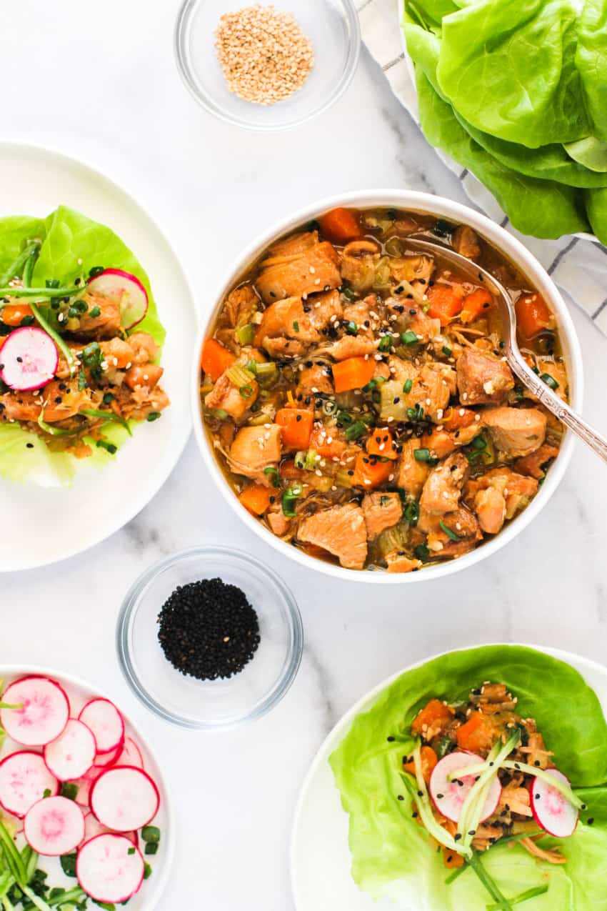 sweet and tangy asian chicken in white bowl with spoon
