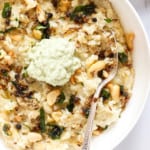 ven pongal served in a white bowl with coconut chutney