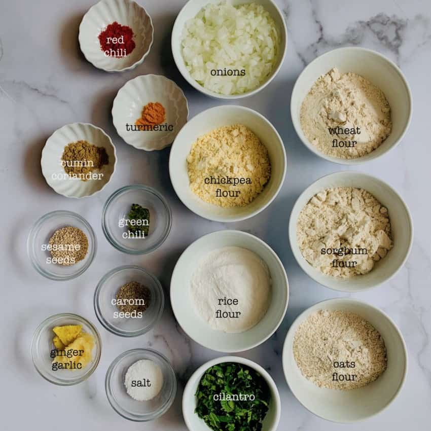 Thalipeeth Ingredients in individual bowls 