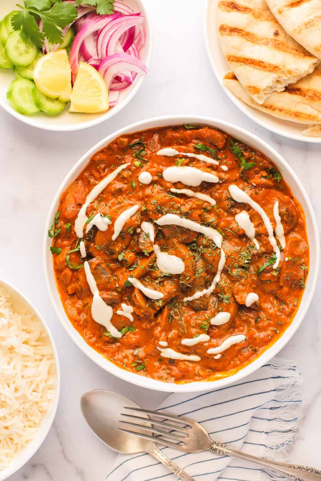 Mushroom masala served with naan and rice