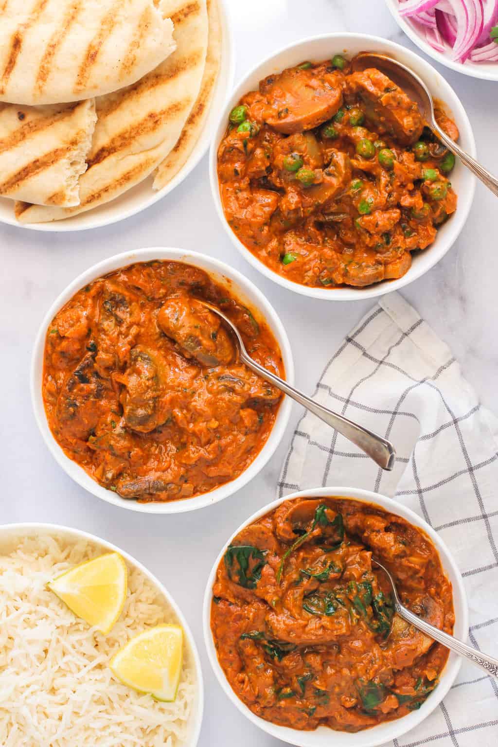 mushroom masala, mushroom peas curry and spinach mushroom served with naan & rice