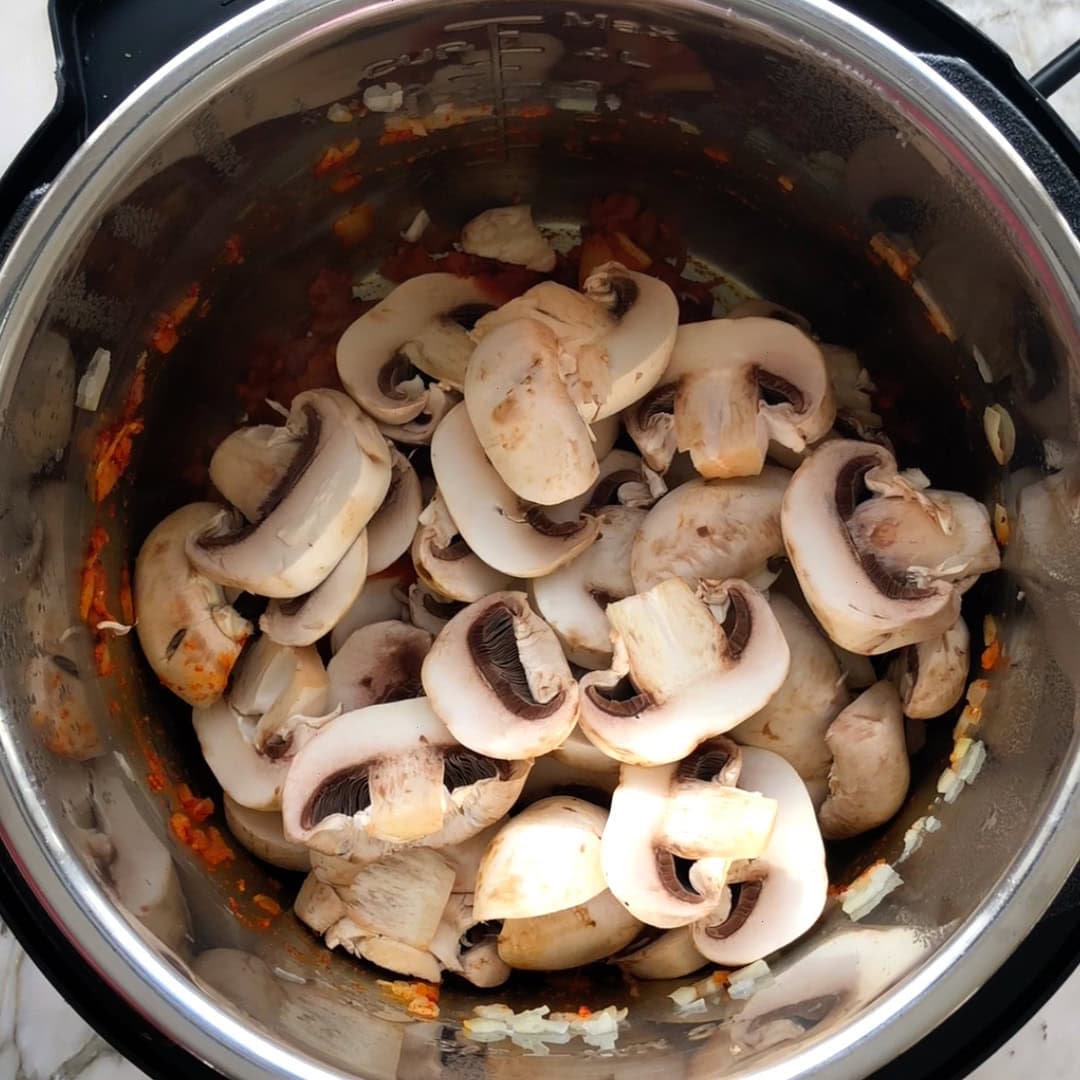 sliced mushrooms added to the Instant Pot 