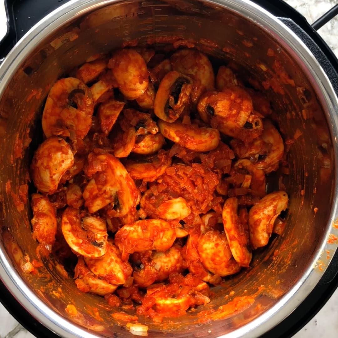 mushroom masala ready to be pressure cooked