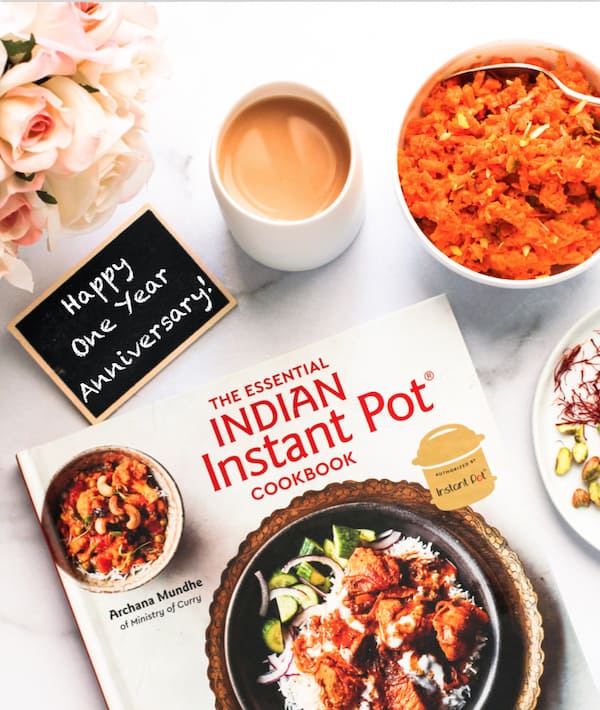 Cookbook with tea and carrot halwa 