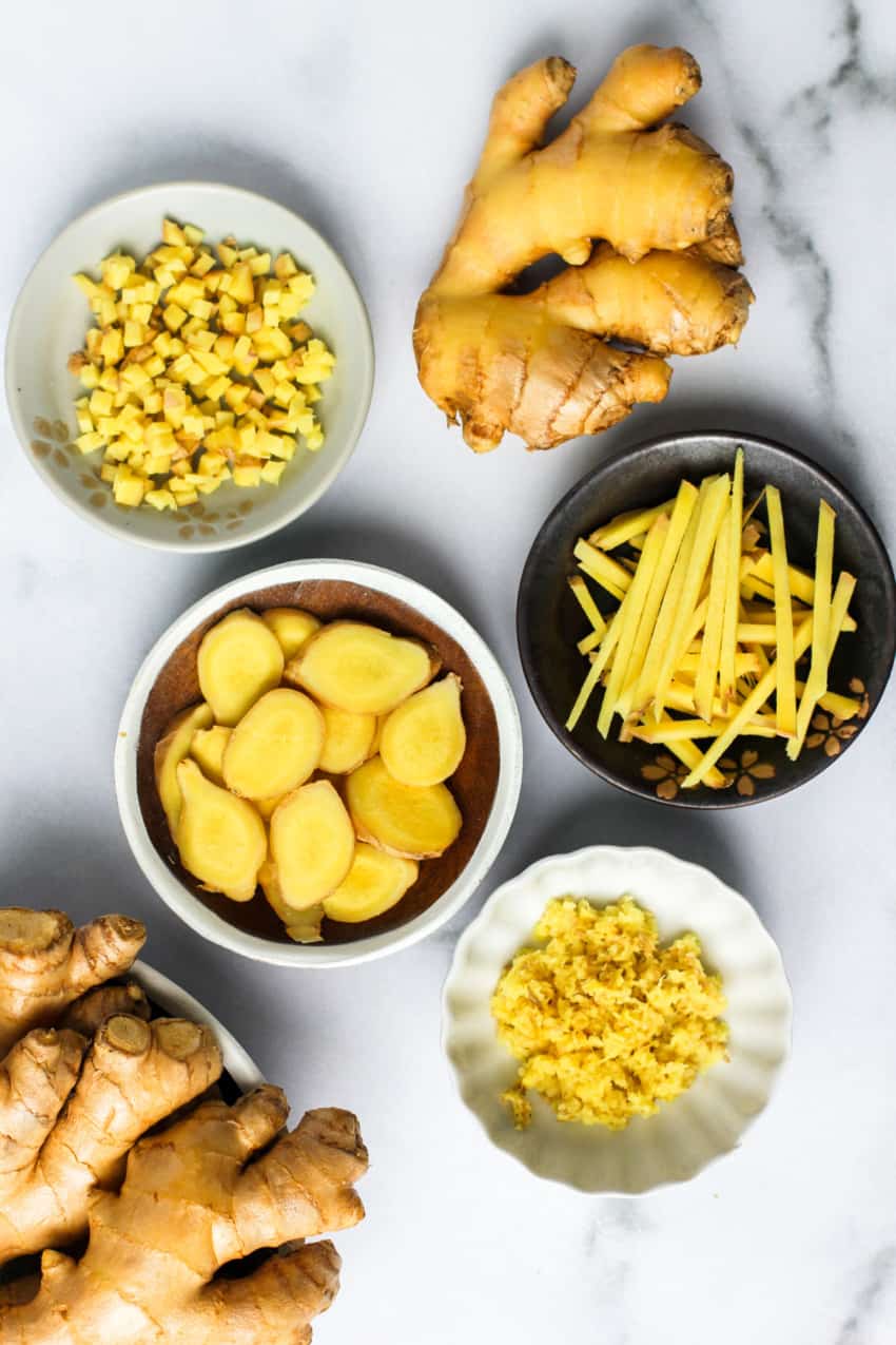 whole ginger root, slices, diced, silvers and paste in bowls