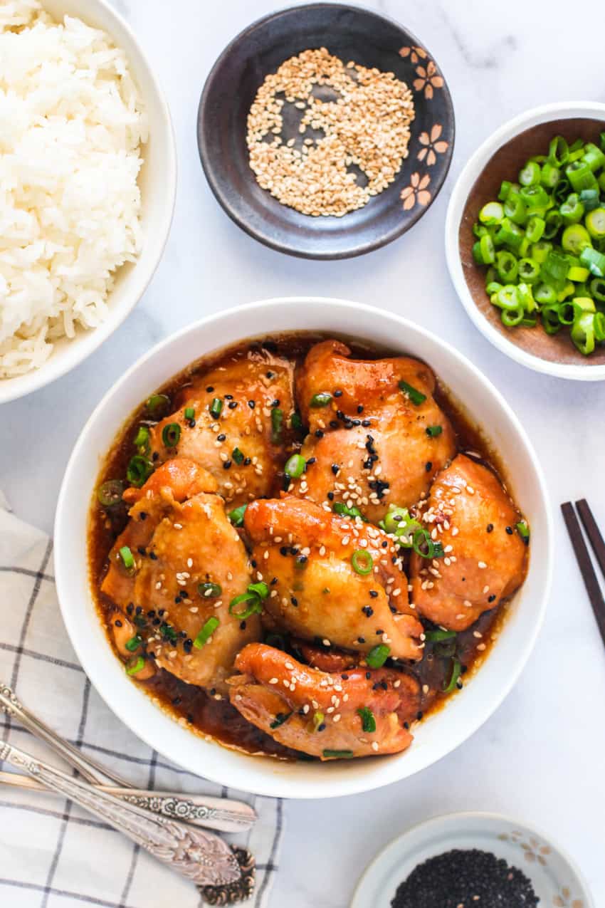 garnished with sesame seeds and scallions