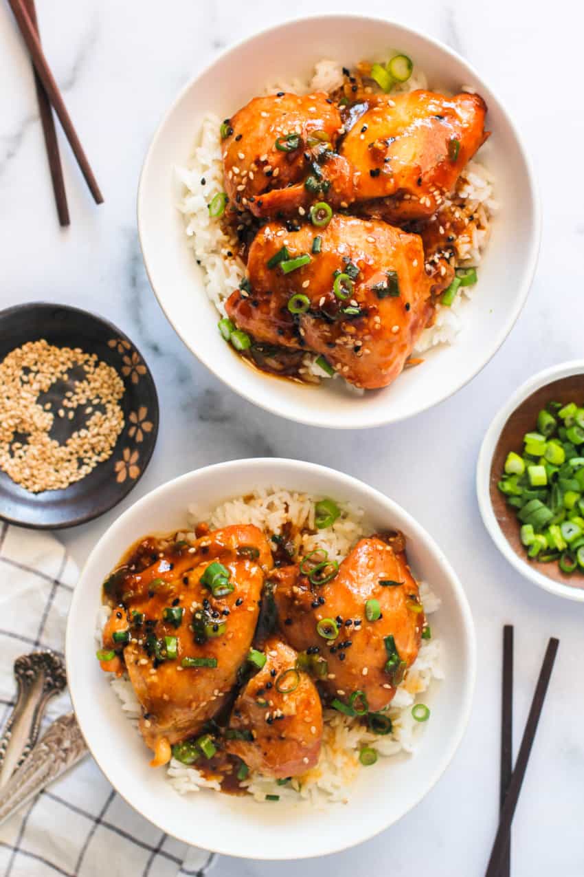 Chicken Teriyaki served in 2 white bowls with rice