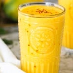 Mango lassi garnished with saffron