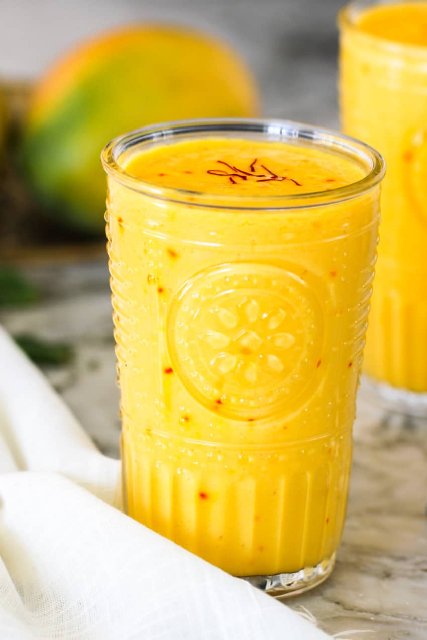 mango lassi in a glass cup