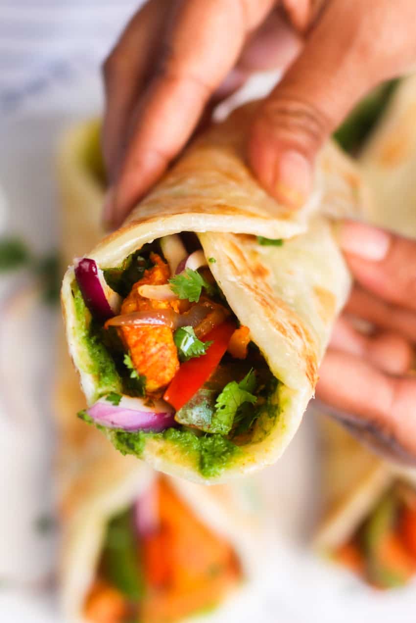 holding chicken kathi roll 
