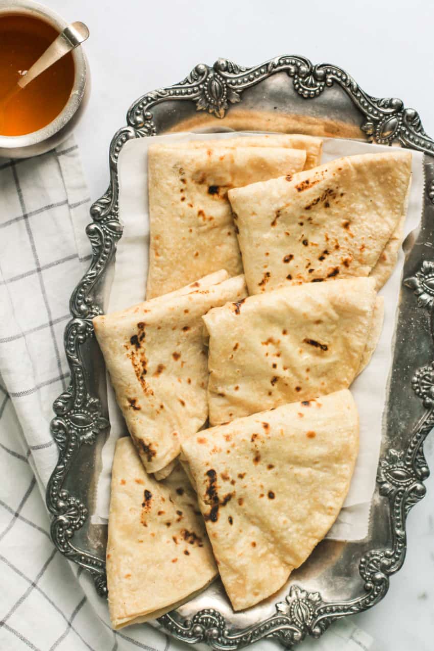 folded roti in a silver platter 