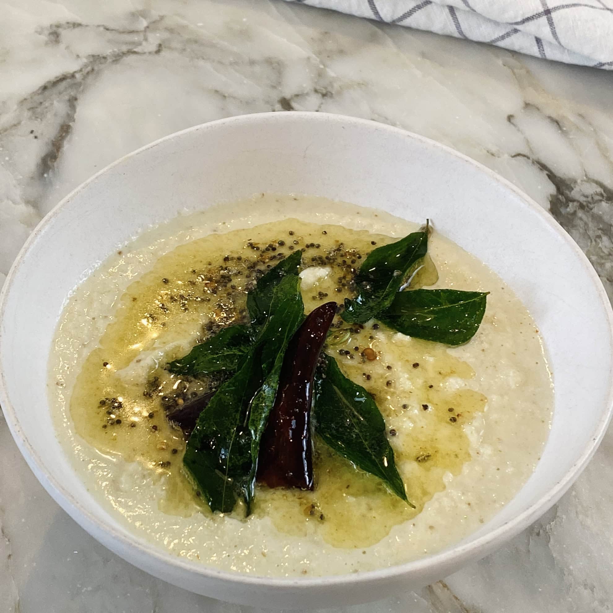coconut chutney with tadka on top.