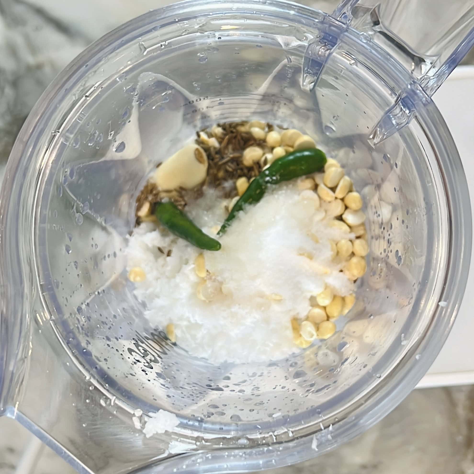ingredients for coconut chutney in blender jar.