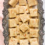 badam burfi in a tray