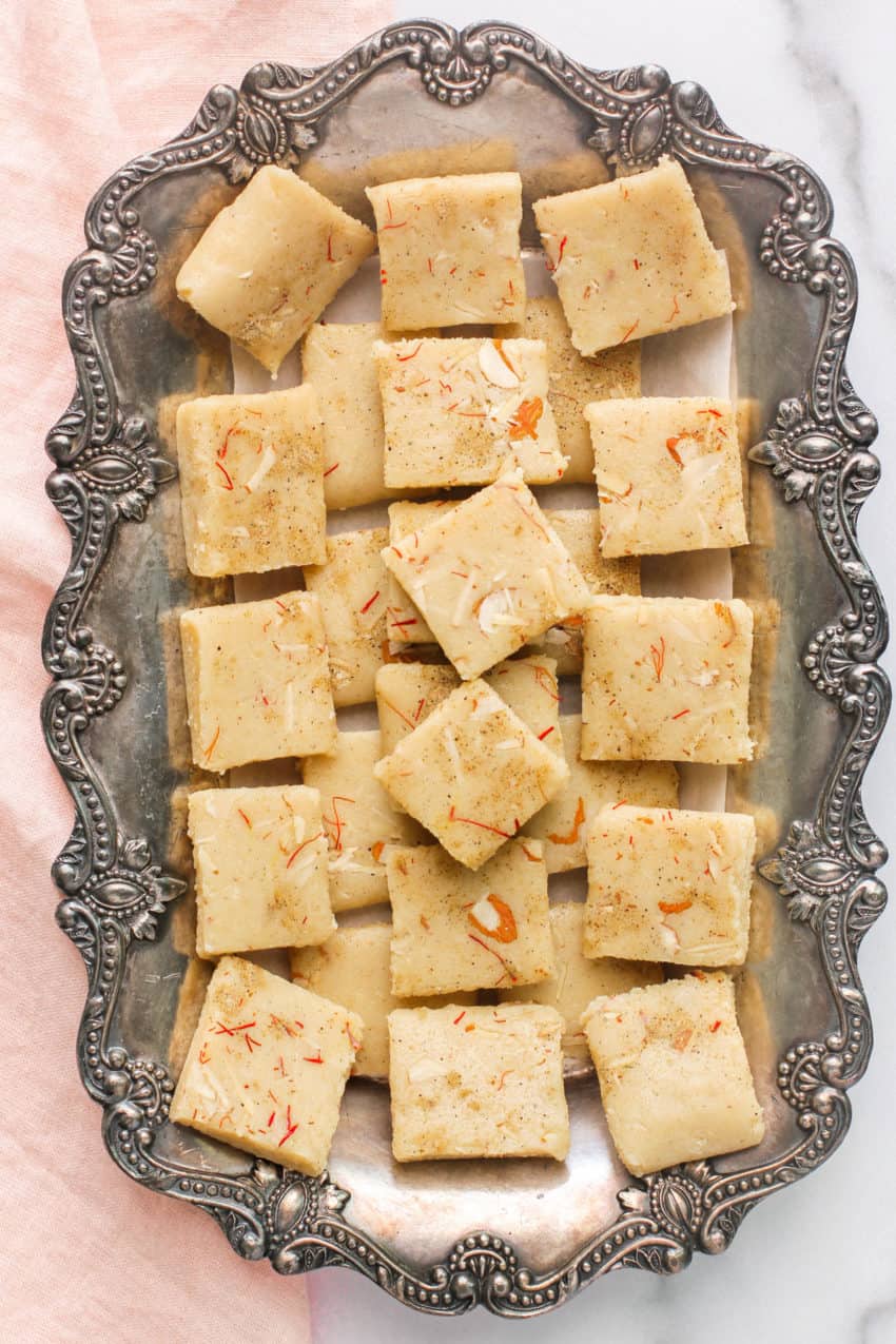 badam burfi in a silver tray