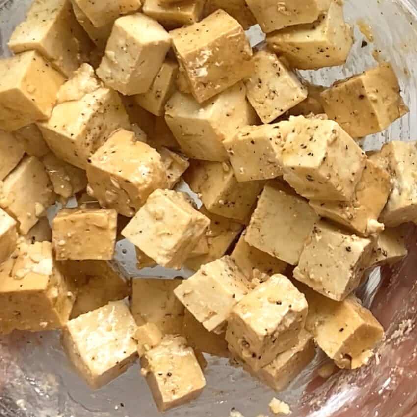 marinated tofu cubes in a bowl 