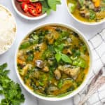 Thai green curry served in 2 bowls
