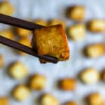 baked tofu in chopsticks