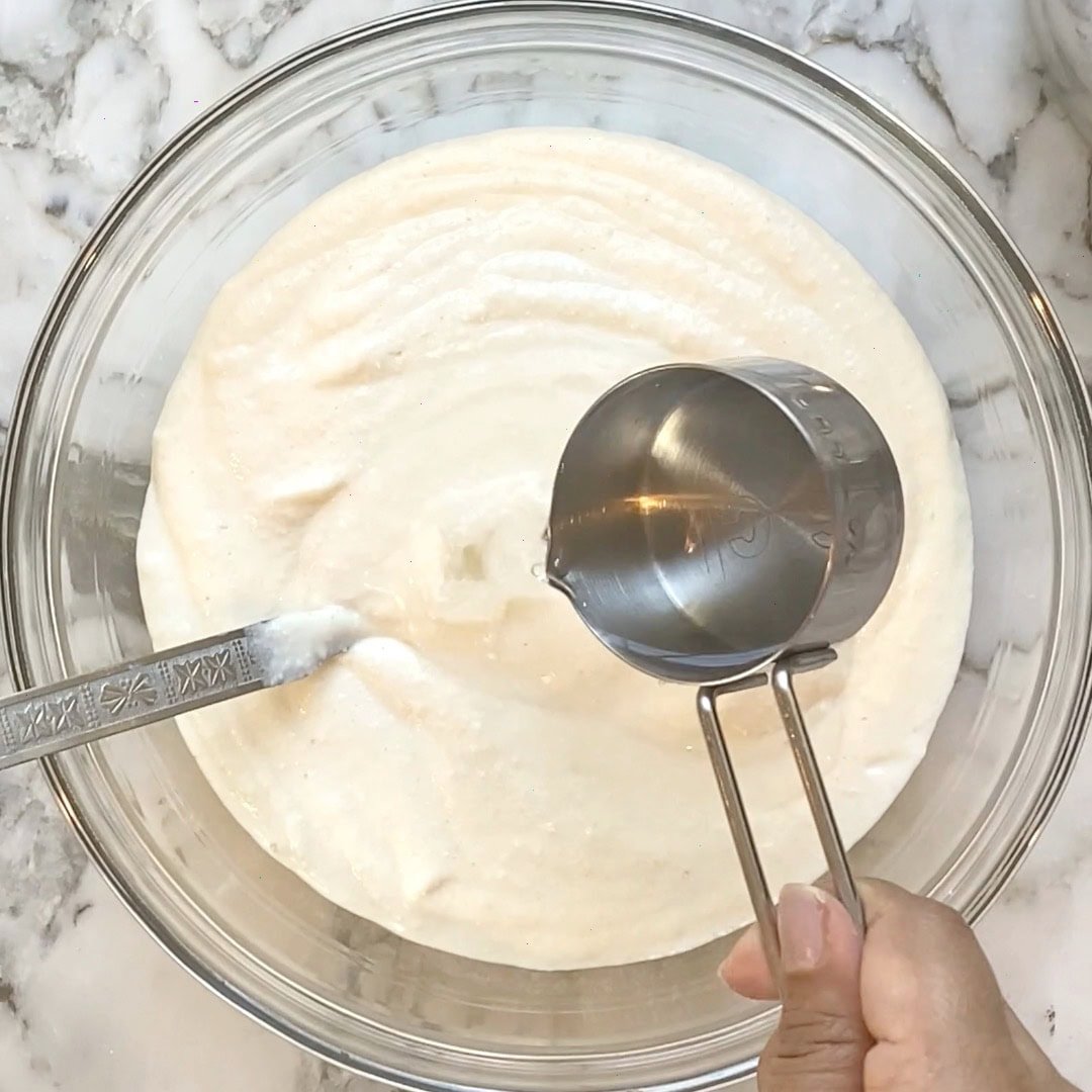 adding water to uttapam batter to make it flowy 