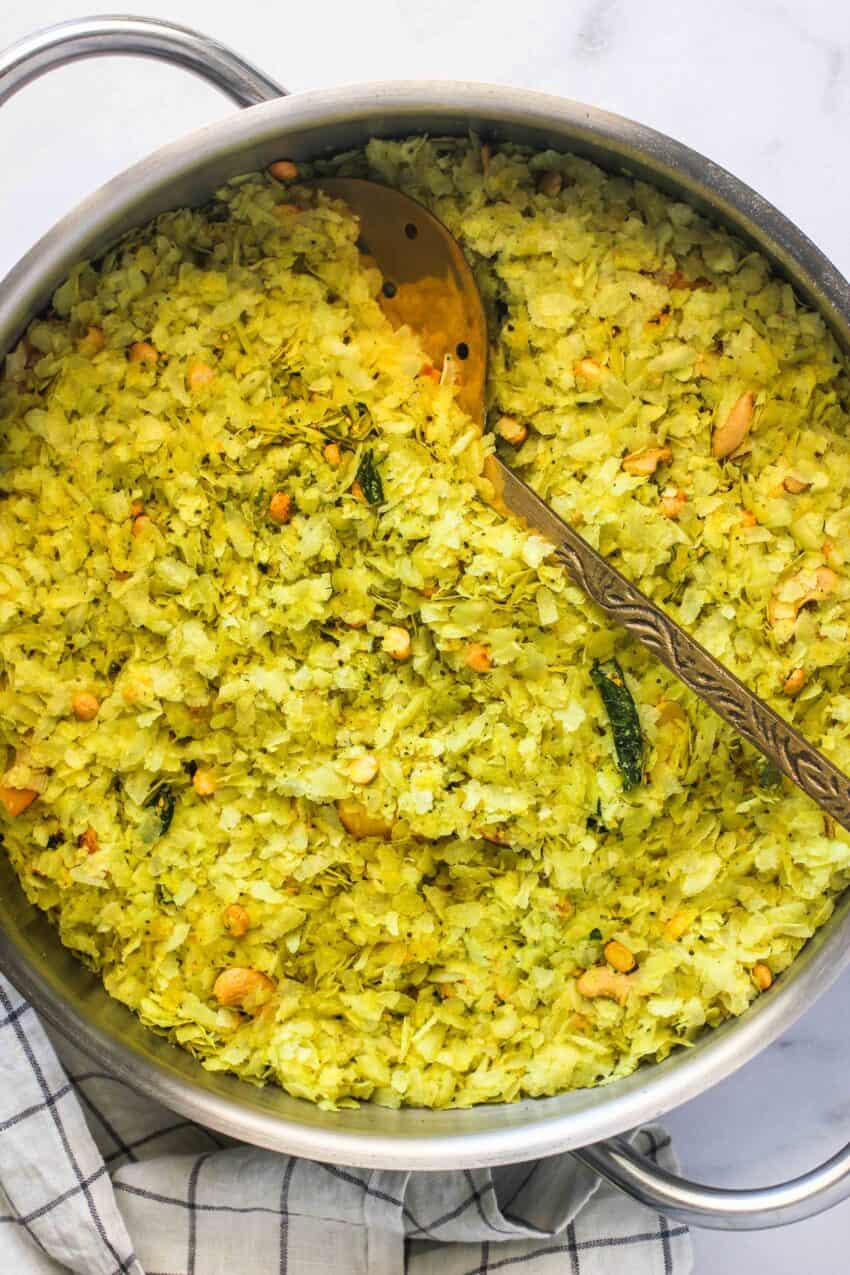 Chivda in a large pot with spatula 