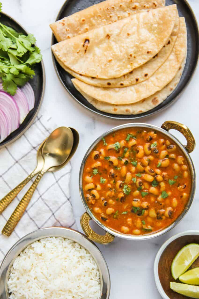 Black eyed peas curry served with roti and rice