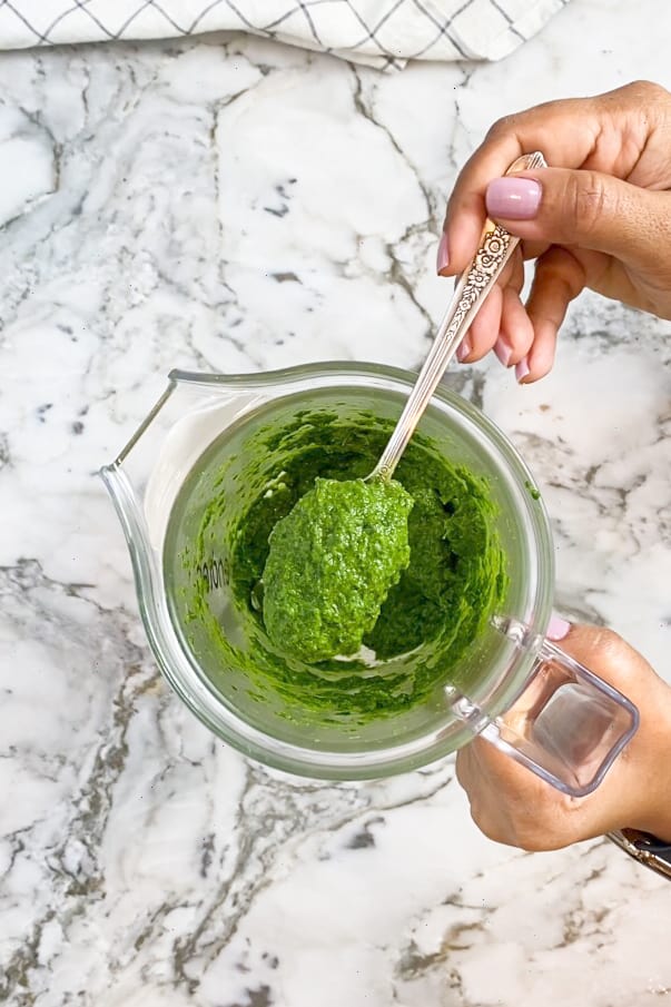 Green herb chutney in a blender 