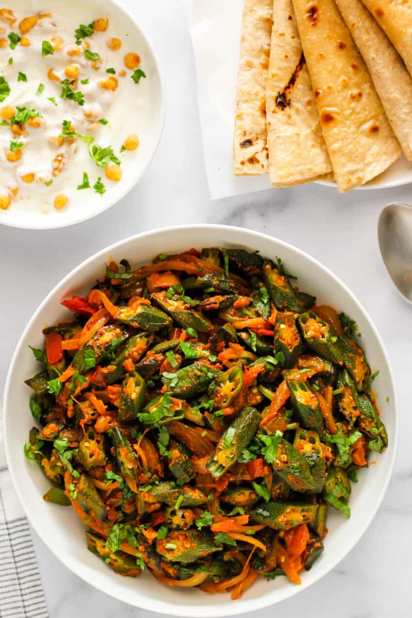 masala bhindi in a white bowl 