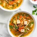 lemon coriander soup in 2 white bowls