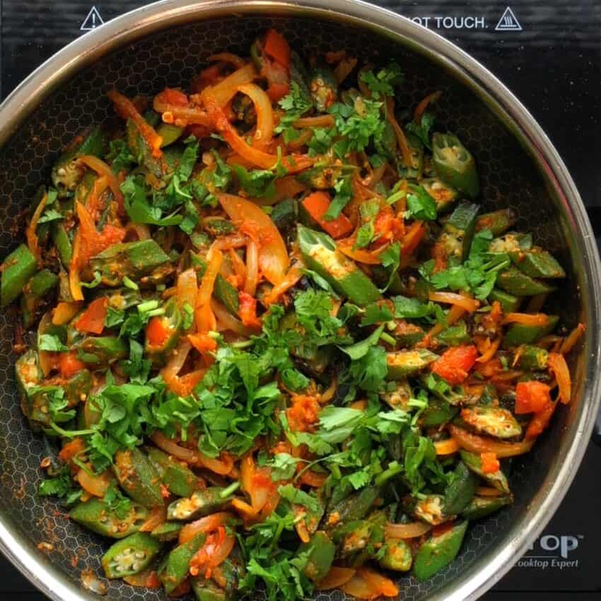 okra in a pan garnished with cilantro 