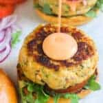 salmon burger with drizzle of sriracha mayo