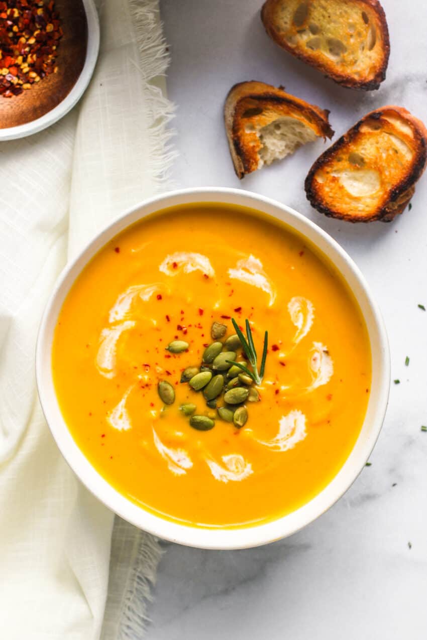 Butternut squash soup served with toasted sliced baguette 