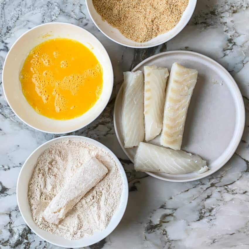 coating fish in flour 