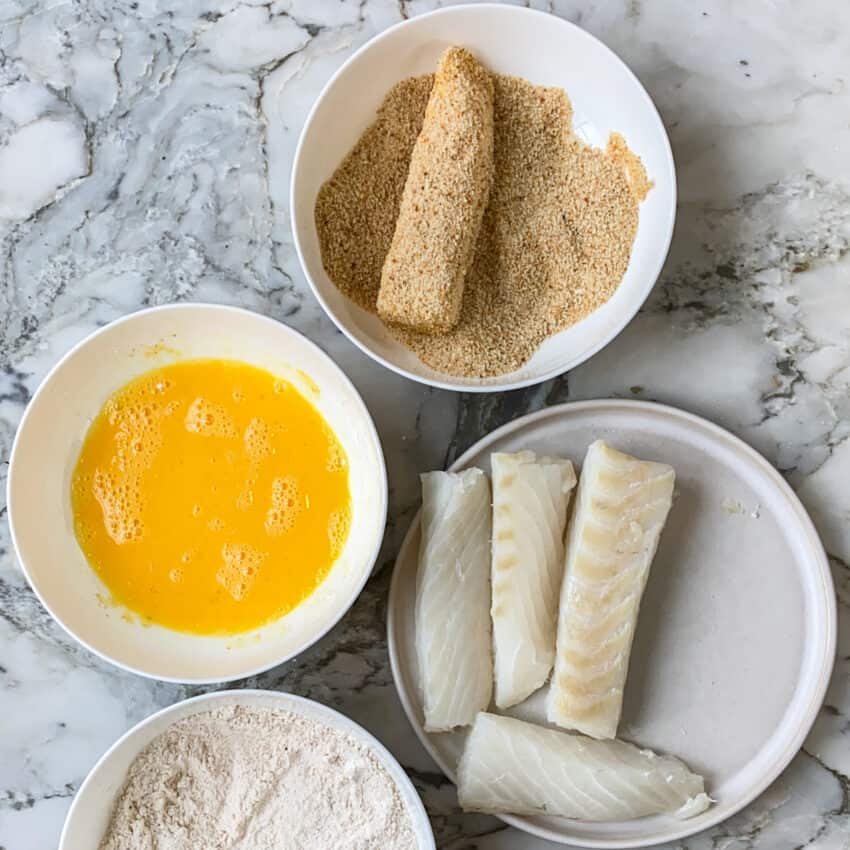 coating fish with bread crumbs 
