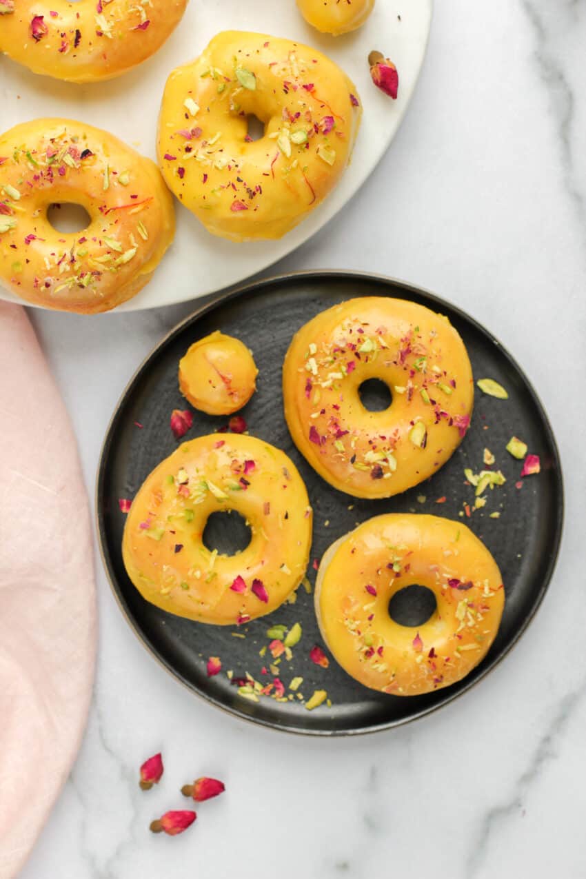 saffron glazed donuts in 2 plates 