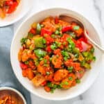 chilli chicken garnished with scallions