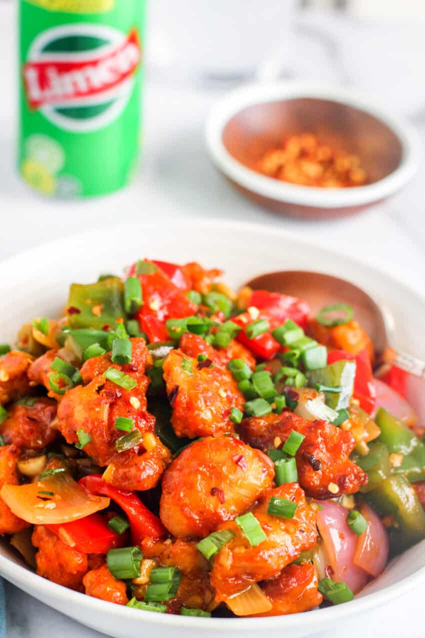 chili chicken served in a white bowl