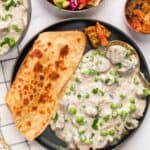 mushroom matar malai served with paratha, rice and cabbage salad