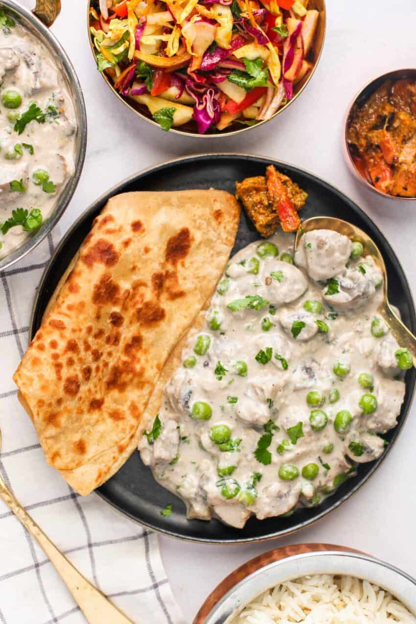mushroom matar malai served with paratha, rice and cabbage salad 