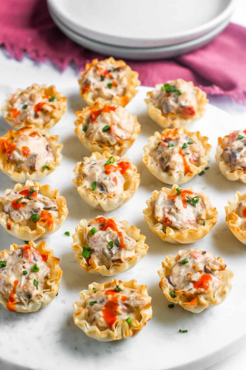 mushroom tartlets served on a marble board