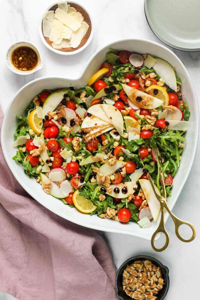 Arugula salad in a heart shaped serving platter