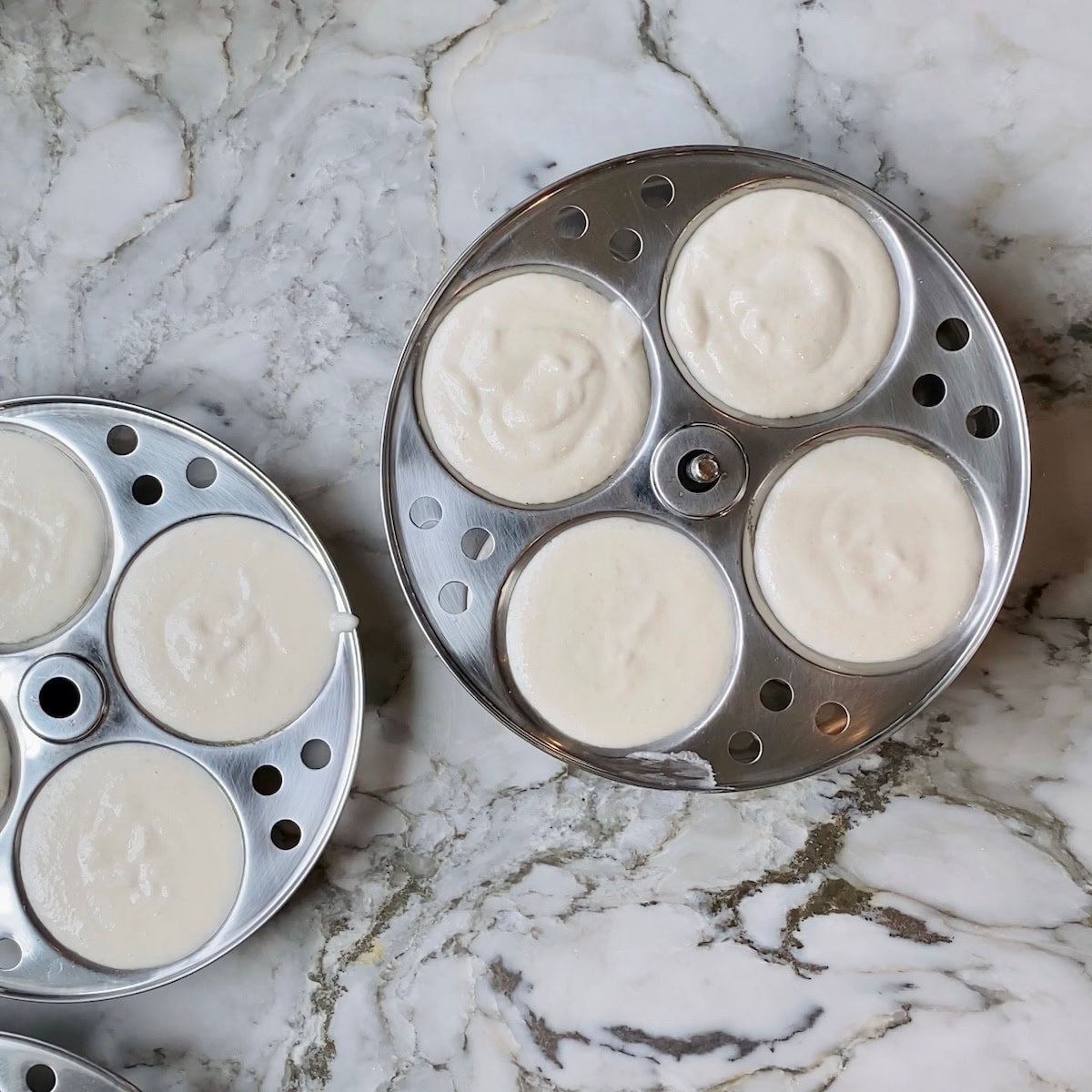 idli batter filled in the idli plates 