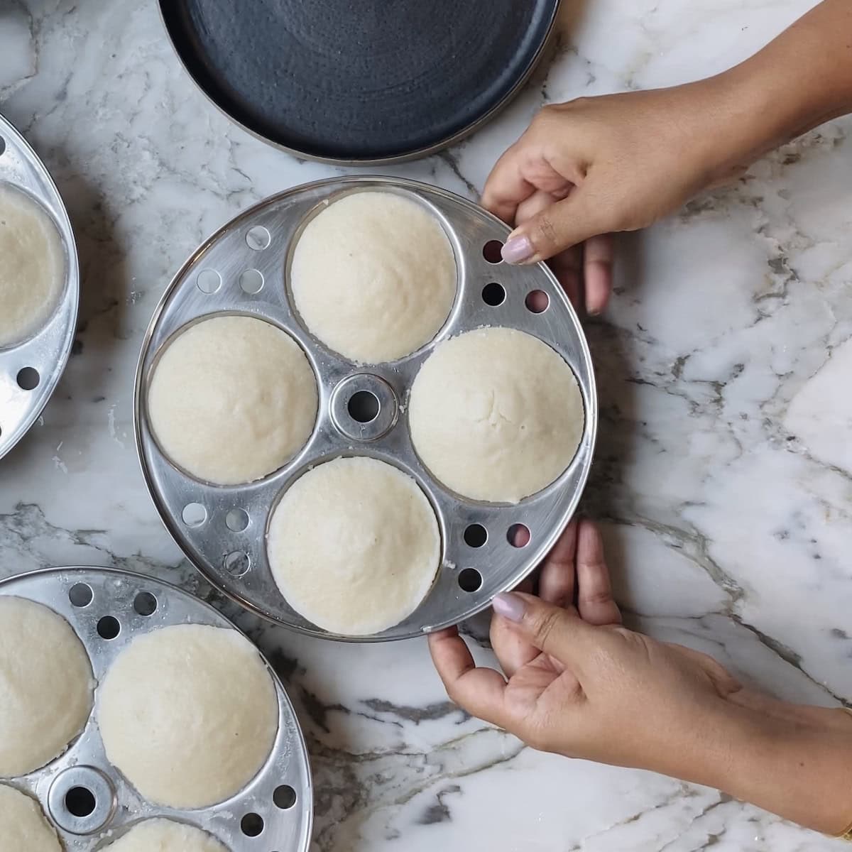 seperating the plates from the idli rack. 