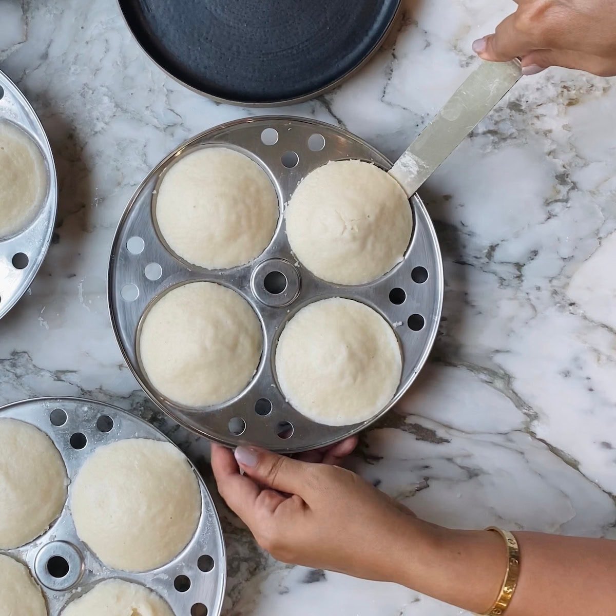 run a knife under the idli to help remove them. 