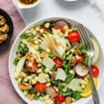 arugula salad with parmesan cheese in a bowl