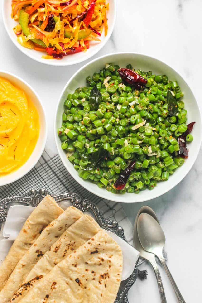Green beans stir fry served with roti and cabbage salad 