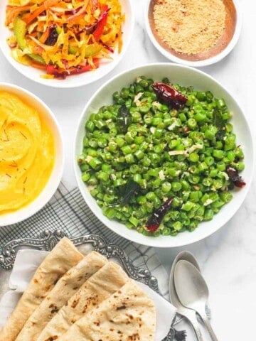 green beans poriyal served with roti, salad, shrikhand, masala