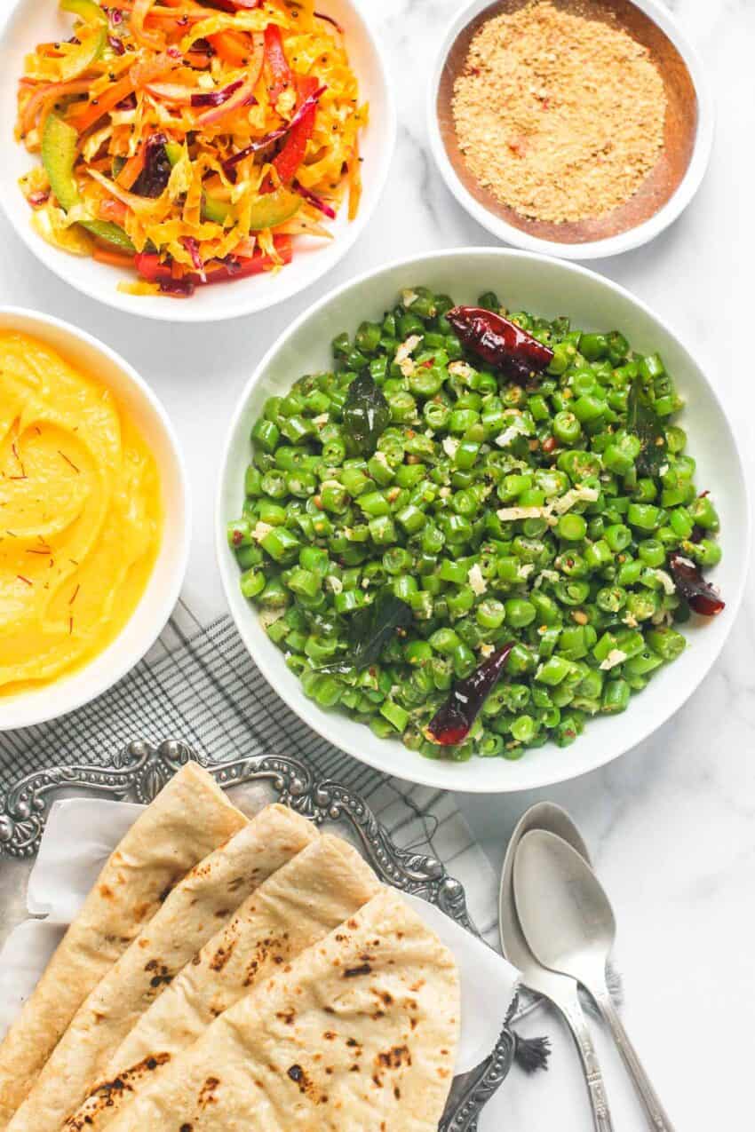 South Indian green beans served with cabbage salad, shrikhand, roti and masala powder 